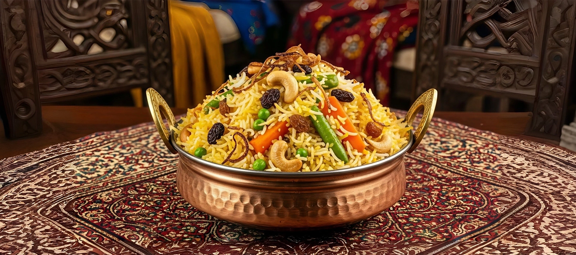 Vegetable biryani with cashews, raisins, and peas served at Best Indian restaurant in Singapore.